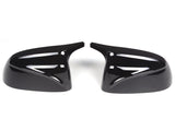 Two glossy black side mirror covers positioned symmetrically, facing each other against a white background, designed for automotive use.
