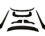 Black car body kit pieces arranged on a white background, including a bumper lip, side skirts, and diffuser parts, all presented symmetrically and evenly spaced.