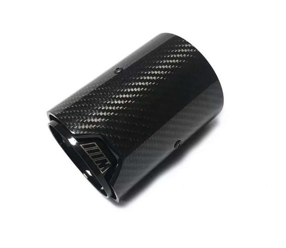 A carbon fiber exhaust tip lies against a plain white background. The surface has a textured pattern. The inner edge features a logo or marking resembling "///M."