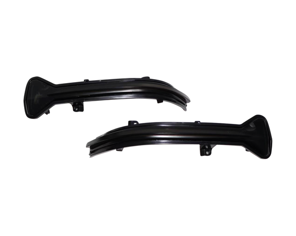 Two black, curved car light covers with attachment points are shown against a plain white background, indicating they are possibly automotive parts for a vehicle.