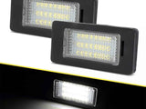 Two rectangular LED lights emit bright white light, enclosed in black frames with a textured surface, displayed against a dark background.