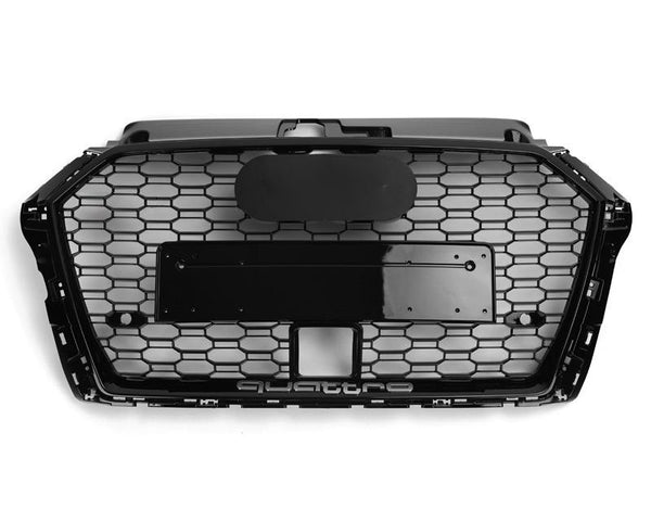 A black hexagonal car grille with a central mounting area sits against a white background. The word "quattro" is embossed at the bottom.