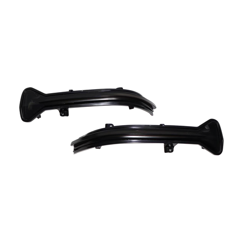 Two sleek, black plastic car parts with mounting brackets are displayed on a plain white background, suggesting components for an automotive lighting system.