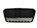 A black car grille with a honeycomb pattern appears against a plain white background, showcasing its sleek design and geometric texture.
