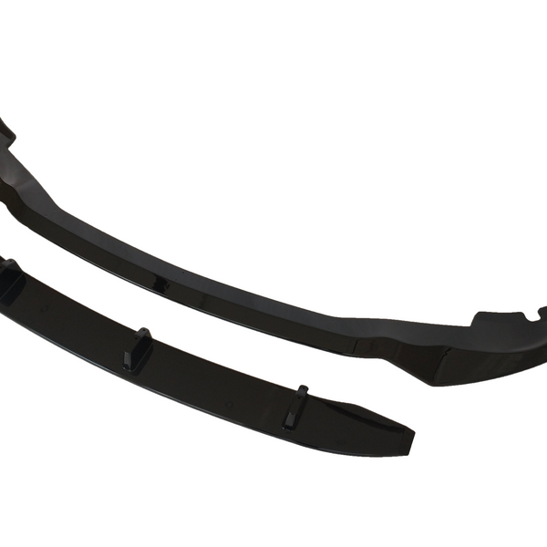 Two glossy black car bumper lip spoilers, positioned side by side, are displayed on a white background. The larger piece features curved ends, while the smaller piece is rectangular with fins.