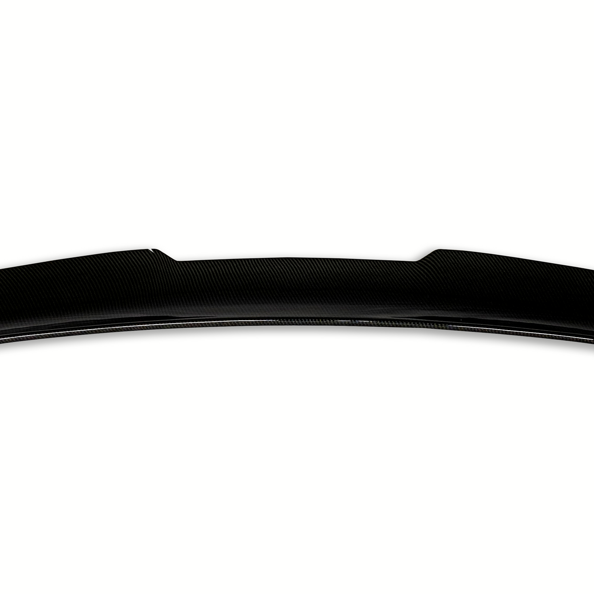 A black carbon fiber car spoiler rests on a white background, showcasing a sleek, curved design with subtle angular details on the edges.