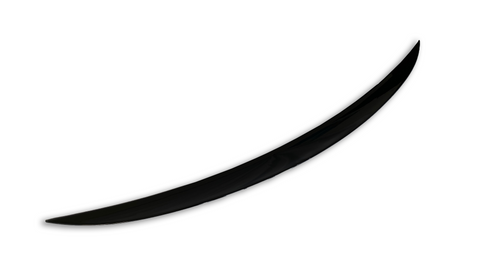 A single, black, curved object resembles a blade or tusk, positioned diagonally against a plain white background, suggesting a sleek and minimalist design.