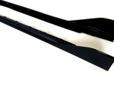 Two black side skirts, sleek and elongated, are positioned parallel on a plain white background.