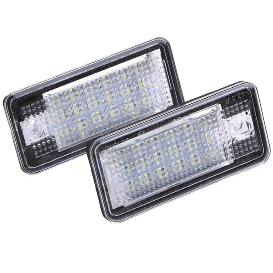 Two rectangular LED lights with a textured surface, positioned overlapping. The units are encased in clear plastic and set against a white background.