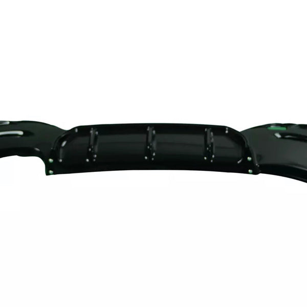 A glossy black car rear bumper with contoured edges lays flat against a plain white background, showing multiple mounting points and subtle ridges for aerodynamic design.