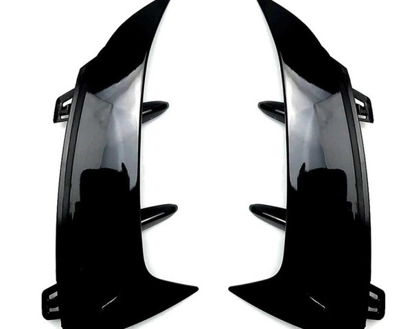Two glossy black car bumper fins are facing each other, designed to be attached via clips. They are positioned on a plain white background.