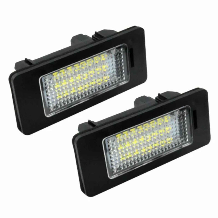 Two rectangular LED car lights with rows of small yellow diodes, surrounded by a black casing, are positioned against a white background.