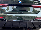 Car rear displays BMW logo and 
