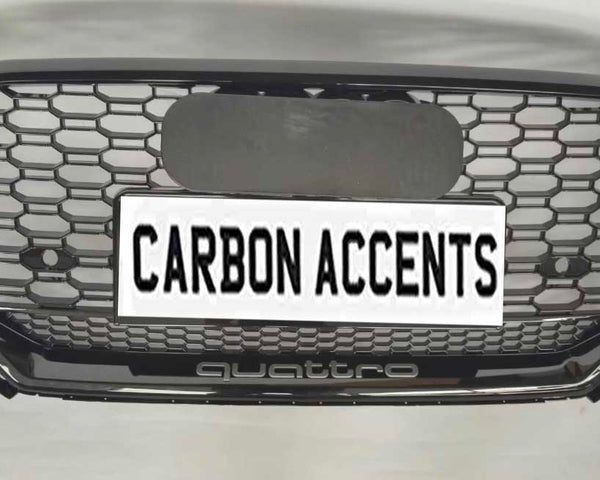 Grille with honeycomb pattern displayed on a light background. It features text "CARBON ACCENTS" on a license plate, with "quattro" written below in smaller lettering.