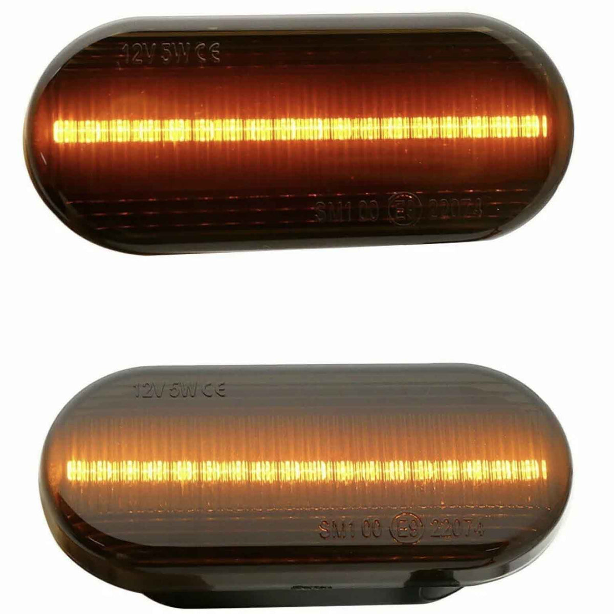 Two oval amber LED lights, one above the other, glow with horizontal strips of light. Both have inscriptions: "12V 5W E6" on the top left and "SM1 00 (E4) 23076" on the bottom.