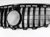 A black car grille with vertical slats and a central circular opening lies against a plain white background.