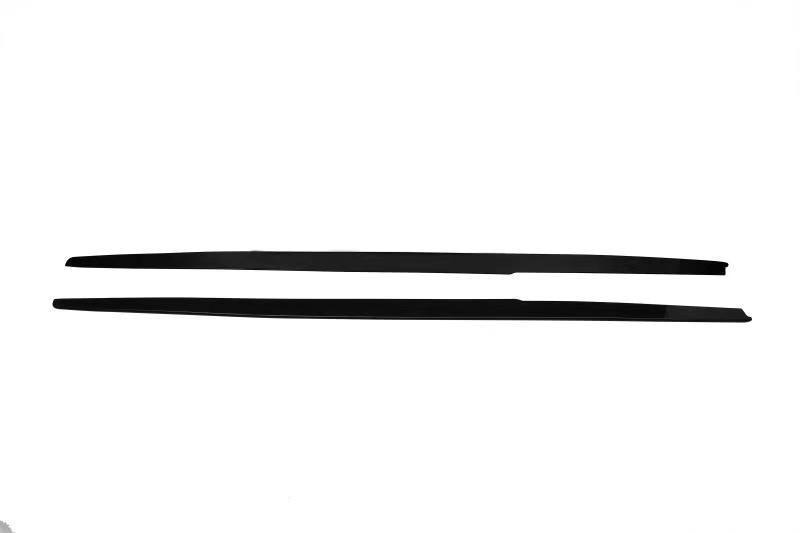 Two long, black, narrow strips lie parallel on a plain white background, appearing as simple lines with tapered ends. No text is present.
