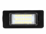 A rectangular LED light with a black frame shines brightly. The lights are arranged in a grid, set against a plain white background.