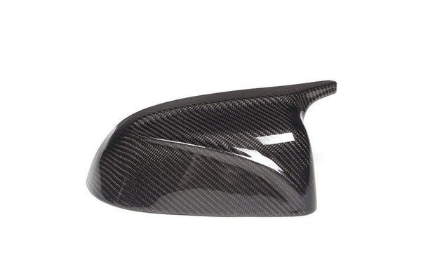 Carbon fiber car side mirror cover with a glossy finish, featuring a sleek, aerodynamic shape against a plain white background. No text is present.