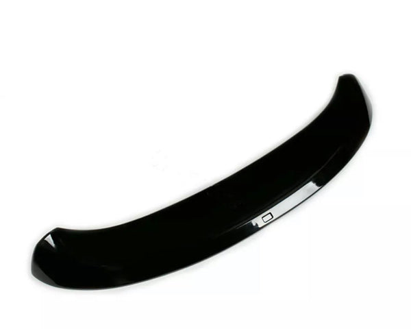 A shiny black car spoiler curves upward, designed to improve aerodynamics, set against a plain white background.