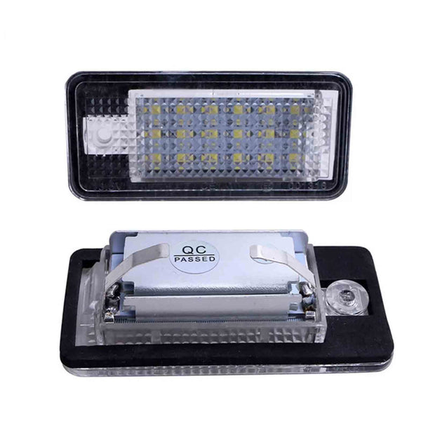 Rectangular LED car light sits on a white surface; diodes visible behind a textured lens. Text reads "QC PASSED" on the component inside, indicating quality control approval.