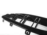 A black car grille features horizontal slats with connectors, set against a white background, highlighting its glossy finish and sleek design.