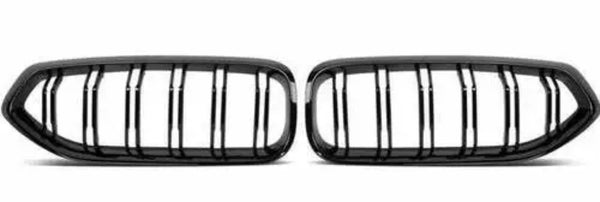 A pair of black car grilles with vertical slats, positioned side by side on a plain white background, designed for air intake on a vehicle's front end.