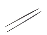 Two black metal chopsticks are parallel, resting on a plain white background, showcasing their sleek, slender design.