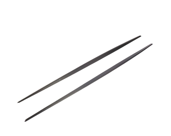 Two black metal chopsticks are parallel, resting on a plain white background, showcasing their sleek, slender design.