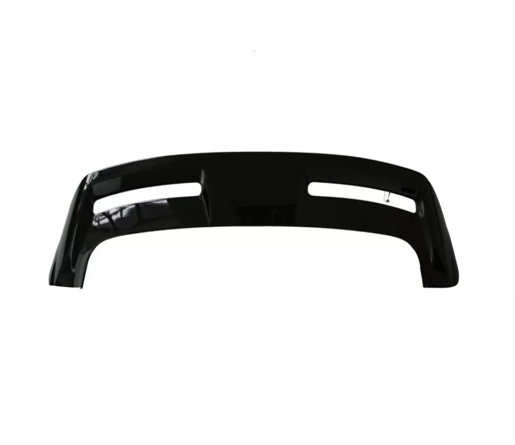 Curved black vehicle bumper with two elongated openings, shown against a plain white background.