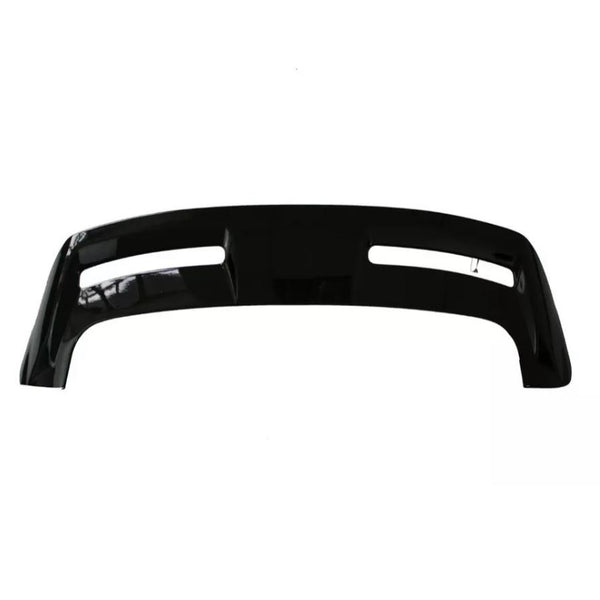 Curved black vehicle bumper with two elongated openings, shown against a plain white background.