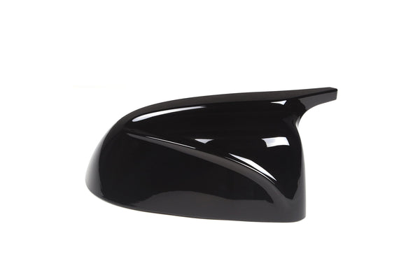A sleek, glossy black car side mirror cover, angled to the right, placed against a plain white background, reflecting light subtly.