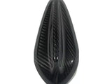 A black, teardrop-shaped carbon fiber object, featuring three central ridges. It is positioned against a plain white background.