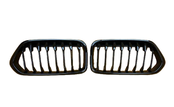 Two black car grilles with vertical slats are displayed side by side against a plain white background.