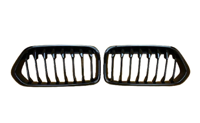 Two black car grilles with vertical slats are displayed side by side against a plain white background.