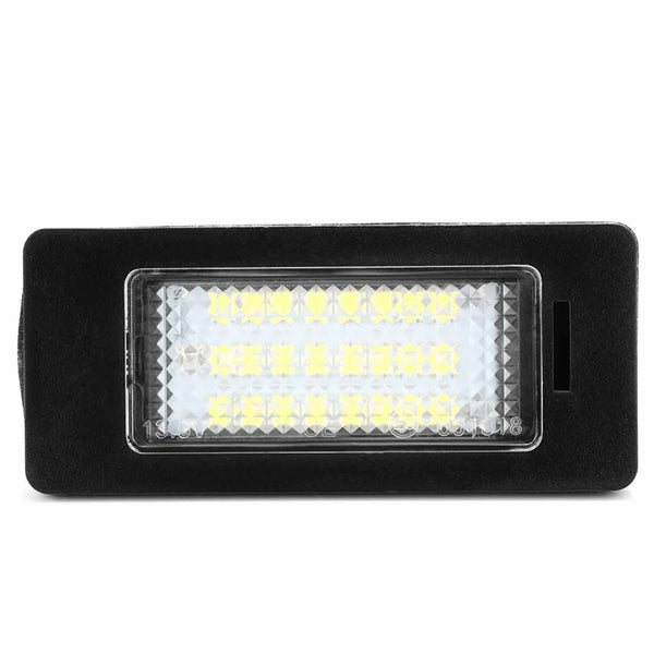 A rectangular LED light panel sits in a black housing, featuring multiple small, yellow LED bulbs arranged in rows, set against a white background.