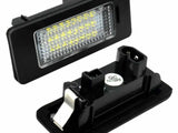 Rectangular LED car light is displayed with a grid-like pattern of yellow LEDs on one side. The back features connectors labeled 
