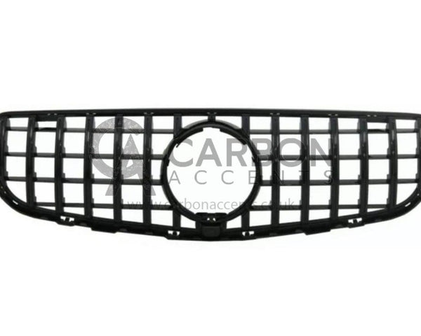 A black, rectangular automotive grille with a honeycomb design, centered round opening, displayed against a white background. Text overlay reads: "CARBON ACCENTS www.carbonaccents.co.uk".