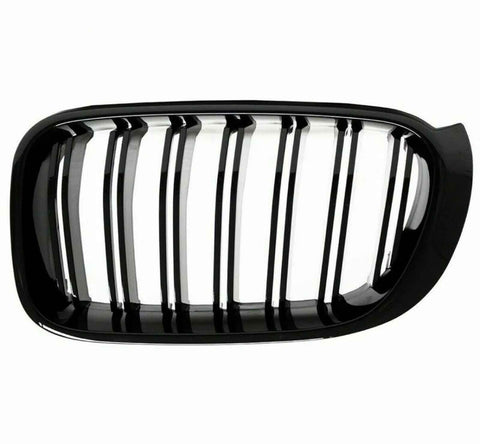 A black car grille with vertical slats, designed for ventilation, is set against a plain white background. The grille has a glossy finish and an oval shape.