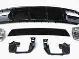 Assorted car parts, including a large black bumper and metallic components, are laid out on a plain white surface, arranged neatly for display or assembly.