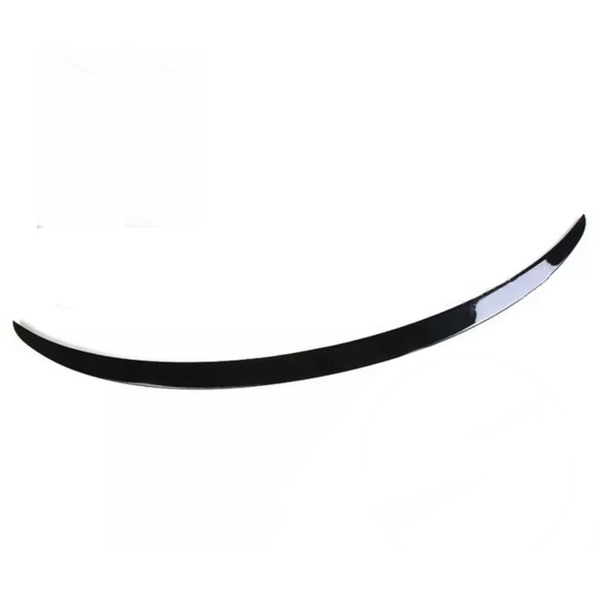 A black, curved spoiler lies on a plain white background, showcasing a glossy finish.