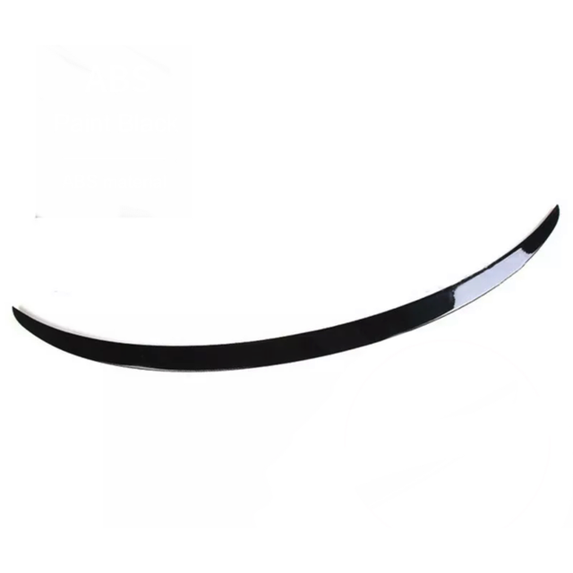 A black, curved spoiler lies on a plain white background, showcasing a glossy finish.