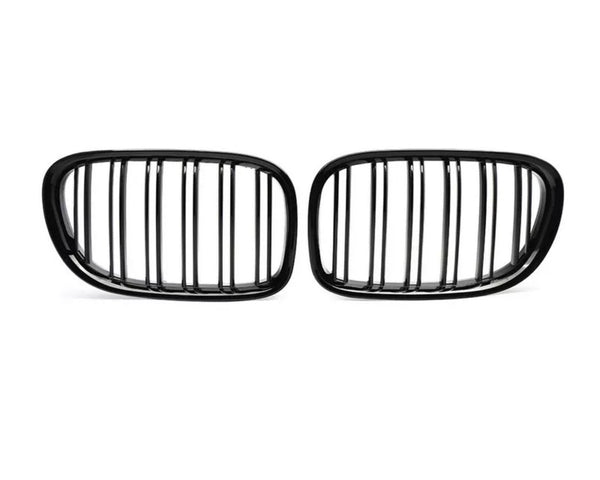 Two black, oval car grilles with vertical slats stand side by side against a white background, highlighting their sleek, symmetrical design.