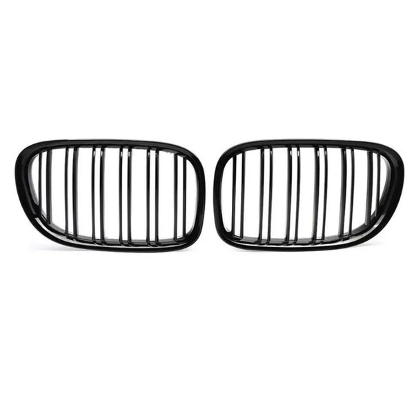 Two black, oval car grilles with vertical slats stand side by side against a white background, highlighting their sleek, symmetrical design.
