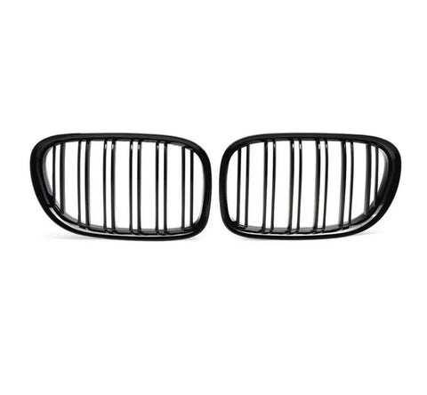 Two black, oval car grilles with vertical slats stand side by side against a white background, highlighting their sleek, symmetrical design.