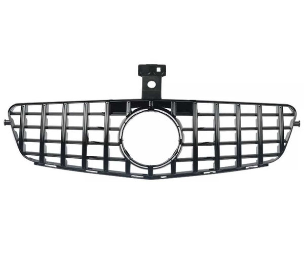 A black car grille with a rectangular grid pattern and central circular opening, positioned horizontally on a white background.