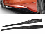 Black side skirts are shown being installed on the lower side body of a red car. The background features a white surface and a zoomed-in view of the car tire.