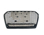 A black, hexagonal-patterned car grille lies against a plain white background, emphasizing its polished surface and open structure.