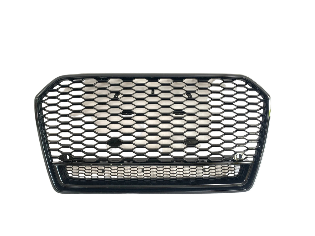 A black, hexagonal-patterned car grille lies against a plain white background, emphasizing its polished surface and open structure.