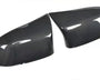 Carbon fiber car mirror covers, positioned side by side, displaying a glossy surface with visible texture, set against a plain white background.